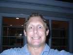 Chris Gill, playing with my camera.  I told him not to play with my camera.  It's not a toy.